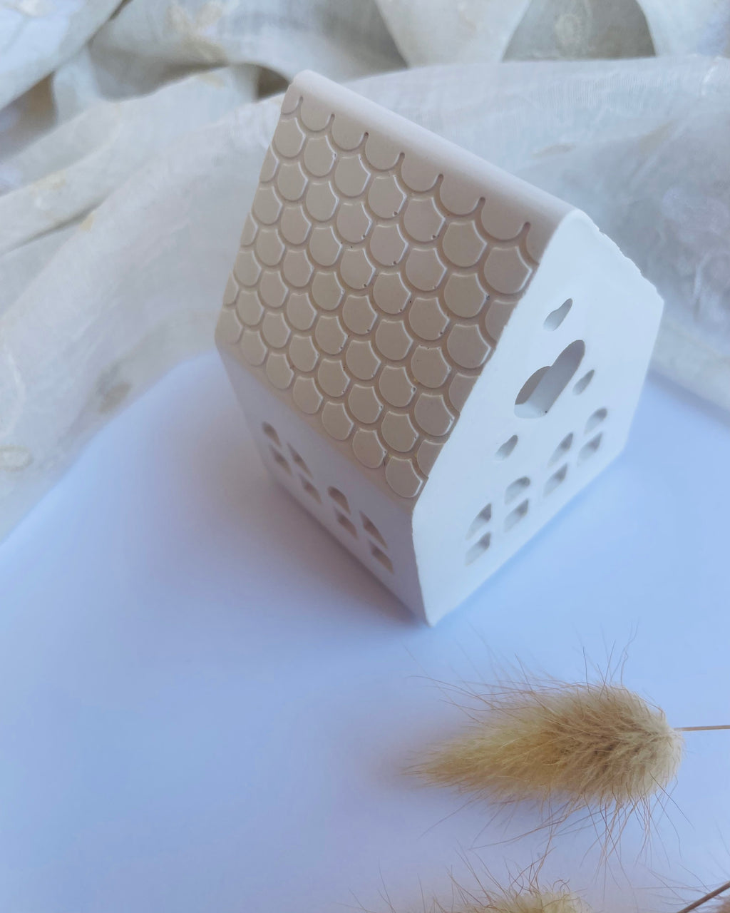 Casa portavelas pequeña