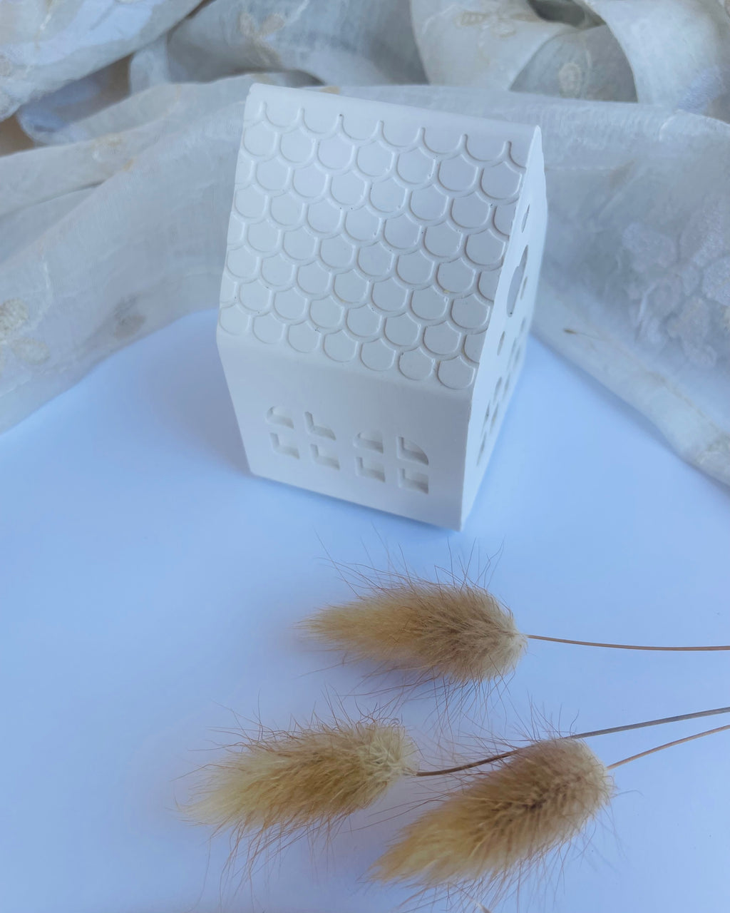 Casa portavelas pequeña